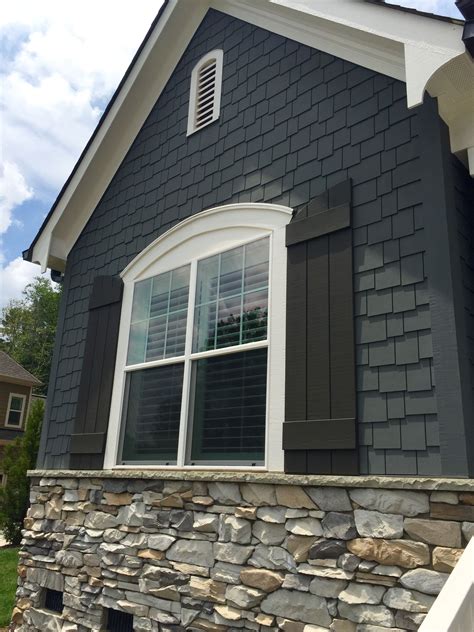 house with grey metal roof|grey houses with black shutters.